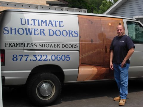 Brian standing next to van